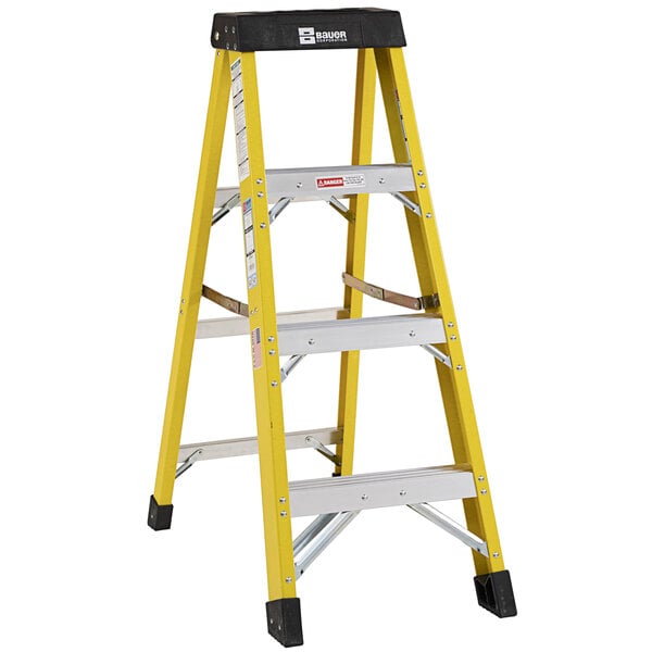 A yellow Bauer Corporation fiberglass step ladder with black top and handles.