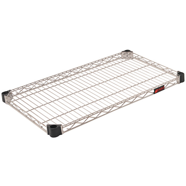 An Eagle Group Quad-Adjust metal wire shelf with black handles.