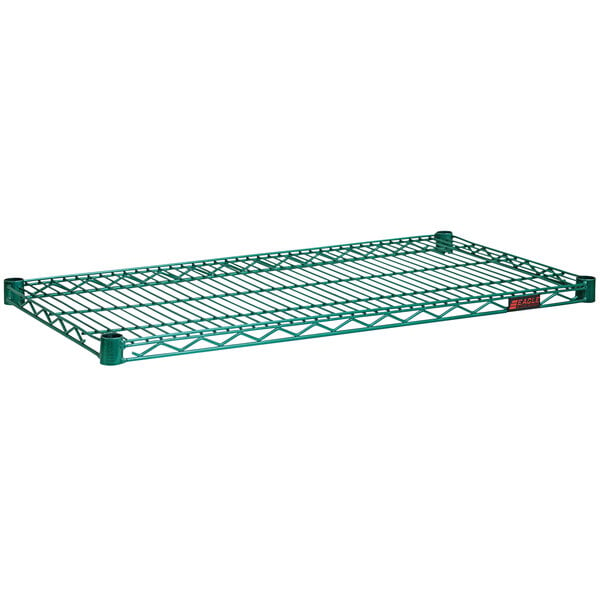 An Eagle Group zinc and green metal wire shelf on a green rack.