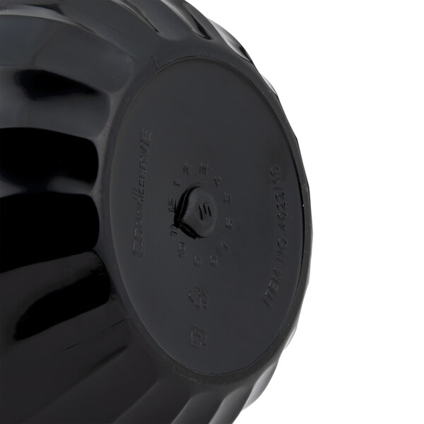 A black plastic Vollrath beverage server with a screw top and a tilt and pour spout.