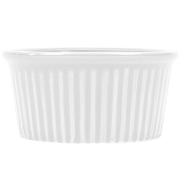 A close-up of a CAC white china fluted ramekin.