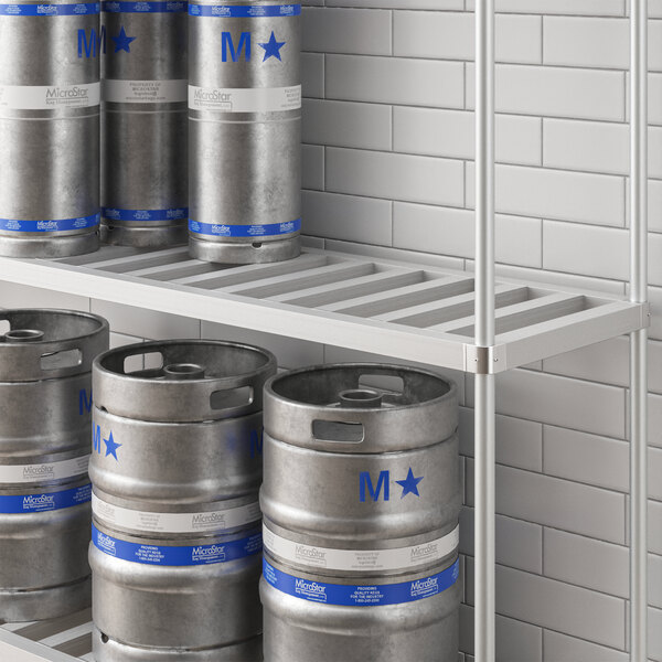 A white Regency bottom shelf holding a group of kegs with blue containers on it.