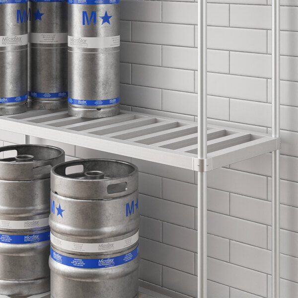 A metal shelf for Regency Keg Racks with beer kegs on it.