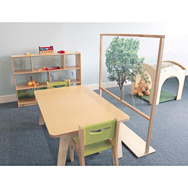 A Whitney Brothers standing floor partition in a classroom with a wooden shelf of toys.