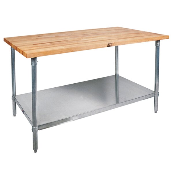 A John Boos wood top work table with a stainless steel base.