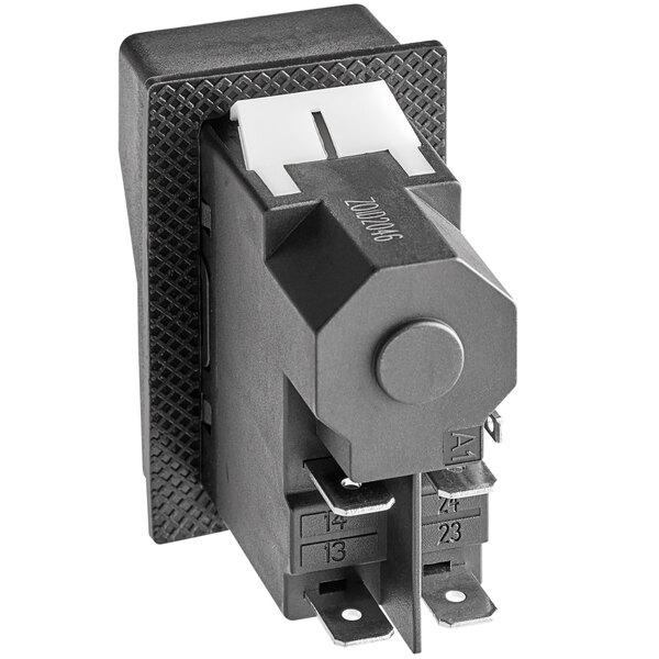 A close-up of a black switch with two wires and a white button.