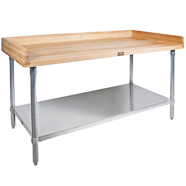 A wood table with a metal base and adjustable metal shelves.