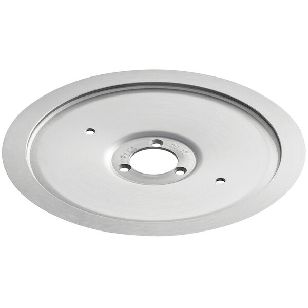 A stainless steel circular blade with a hole in the center.