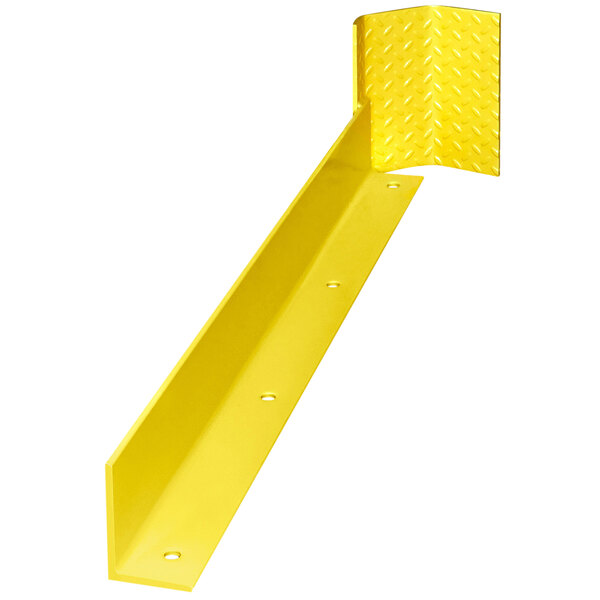 A yellow metal plate with holes in it used as a corner guard.