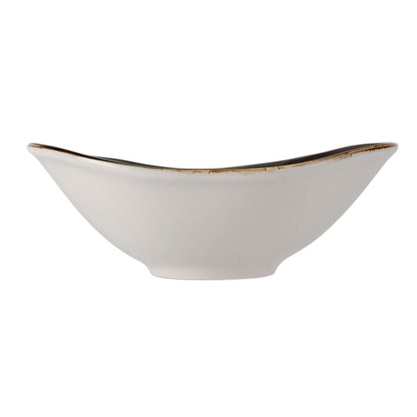 A white Tuxton Capistrano bowl with brown edges.
