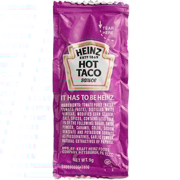 A purple Heinz taco sauce packet with white and black text.
