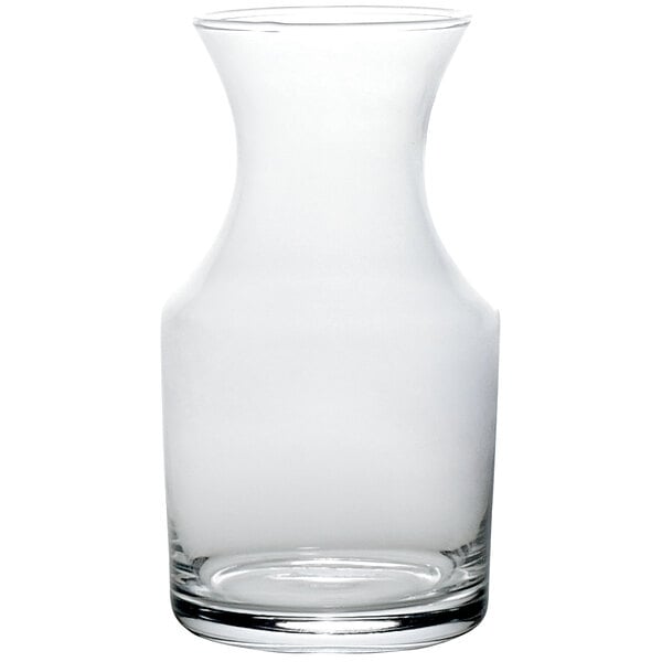 A clear glass carafe with a curved neck.