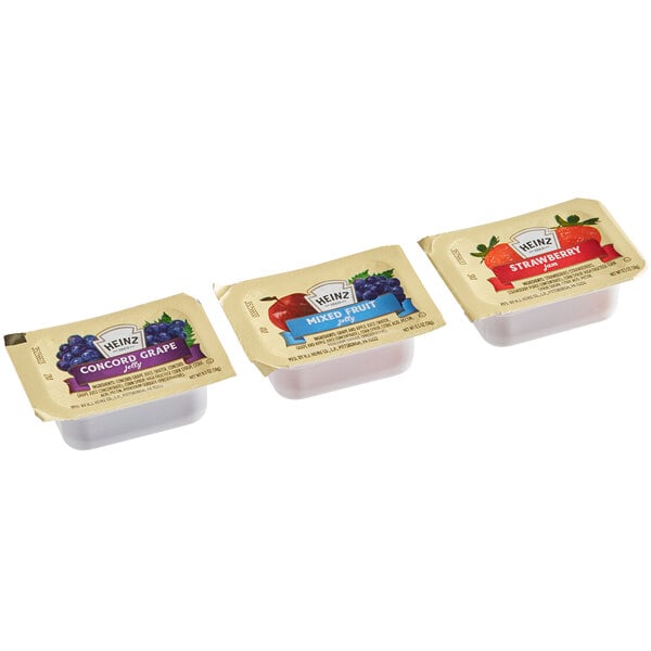 A group of Heinz assorted jelly and jam portion cups.