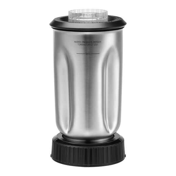 A close-up of a silver Waring stainless steel blender container with a black lid.