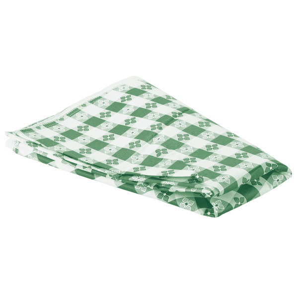 A folded green and white checkered vinyl table cover.