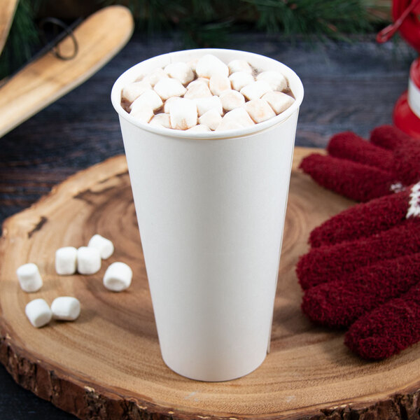 A Dart ThermoGuard white paper hot cup of hot chocolate with marshmallows.