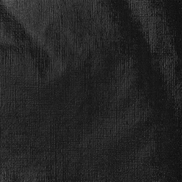 A white background with a black plastic surface with small lines.