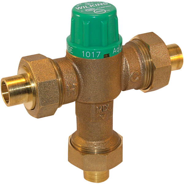 A Zurn brass tempering mixing valve with green and yellow buttons.