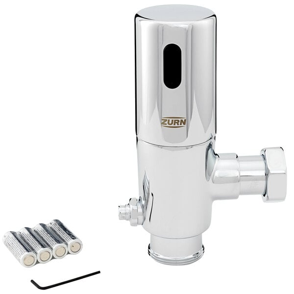 A silver Zurn urinal flush valve body with a black battery pack.