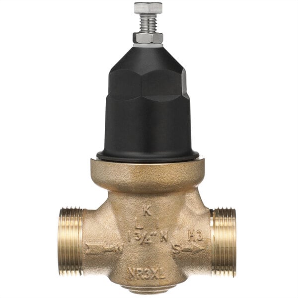 A close up of a Zurn brass water pressure reducing valve with a black cap.