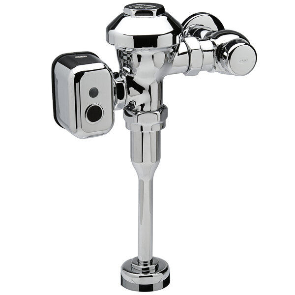 A Zurn chrome urinal flush valve with a hardwired automatic sensor.