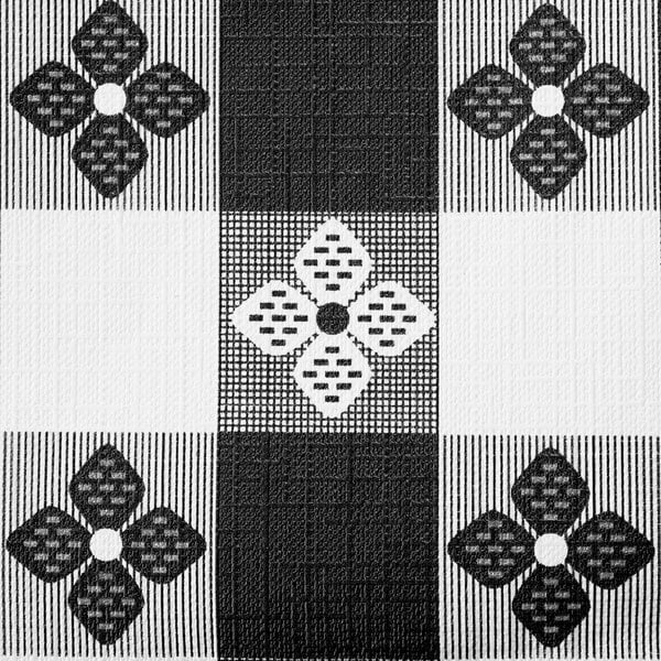 A close-up of a black and white checkered tablecloth with flowers.
