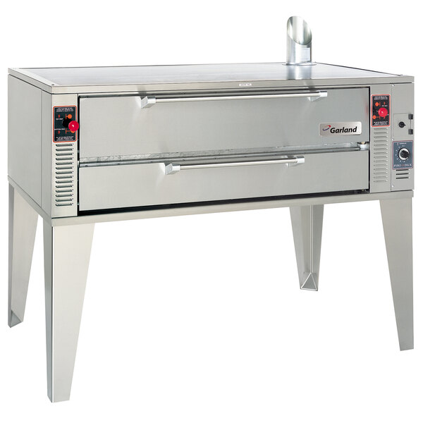 A large stainless steel Garland pizza oven with a handle.