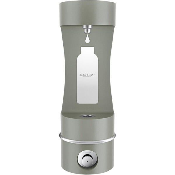 An Elkay grey outdoor wall mount bottle filling station with a bottle of liquid.