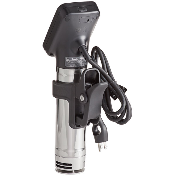 A black and silver Breville Commercial HydroPro sous vide immersion circulator head with a cord on a counter.
