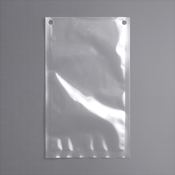 VacPak-It chamber vacuum packaging pouch with holes on a white surface.