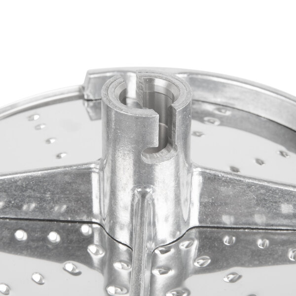 A Robot Coupe stainless steel grating / shredding disc with holes.