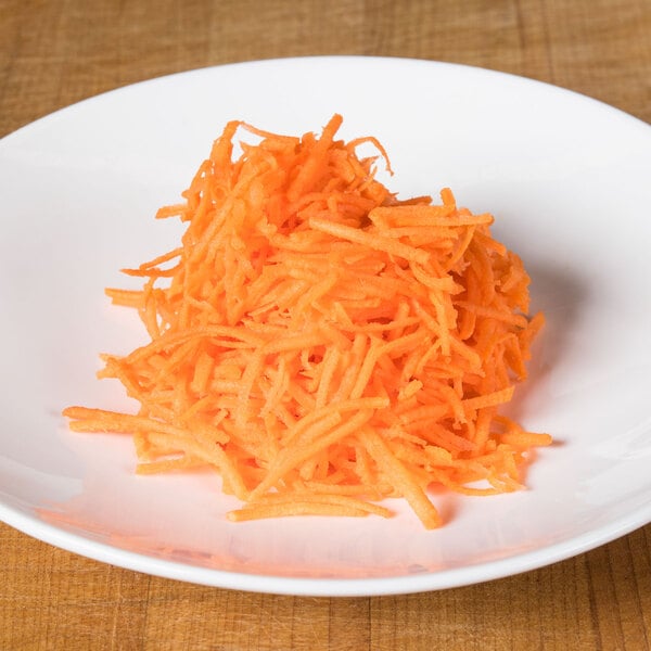 A plate of shredded carrots using a Robot Coupe 1/16" grating and shredding disc.