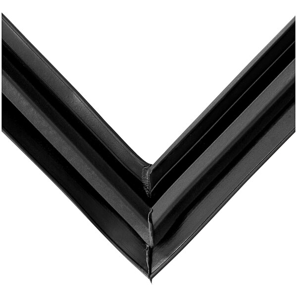 A close up of a black plastic corner piece with two black lines.