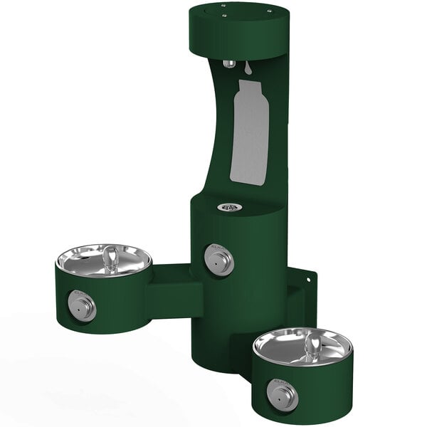 a green water fountain with a bottle
