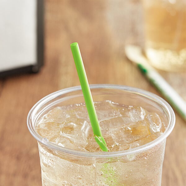 A glass of ice tea with a green EcoChoice compostable straw.