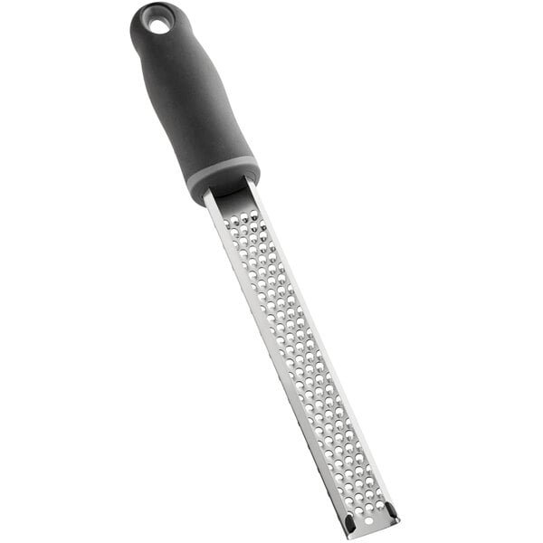 A Choice stainless steel handheld grater with a black handle.