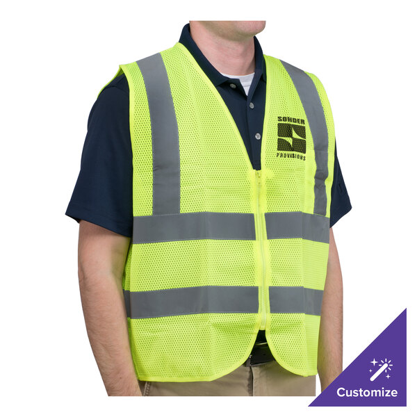 A man wearing a lime green high visibility safety vest.