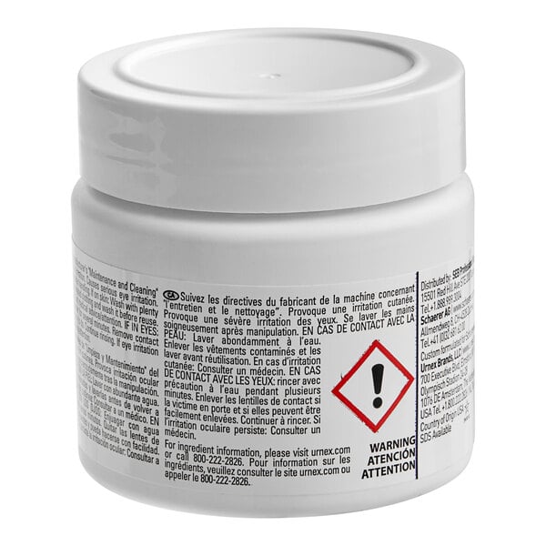 A white plastic container of Schaerer Cleaning Tablets with black and red labels.