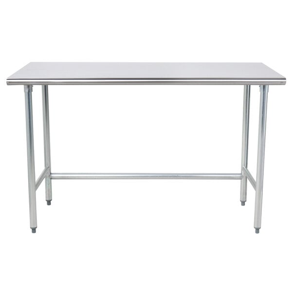 A stainless steel Advance Tabco work table with an open metal base.