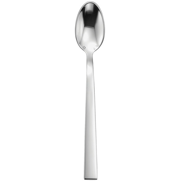 A silver spoon with a white handle.