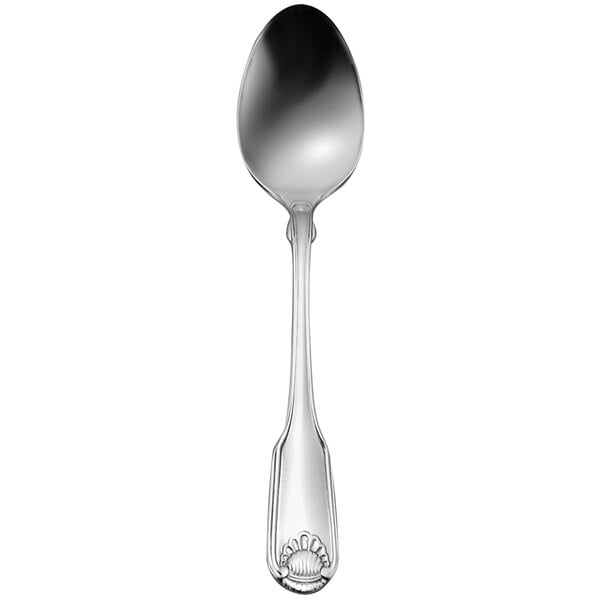 A silver Oneida dessert spoon with a shell design on the handle.