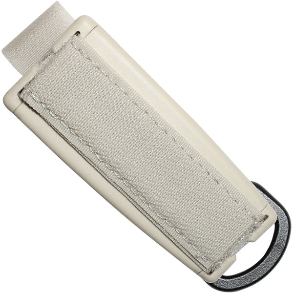 A white fabric utensil holder with a black strap.