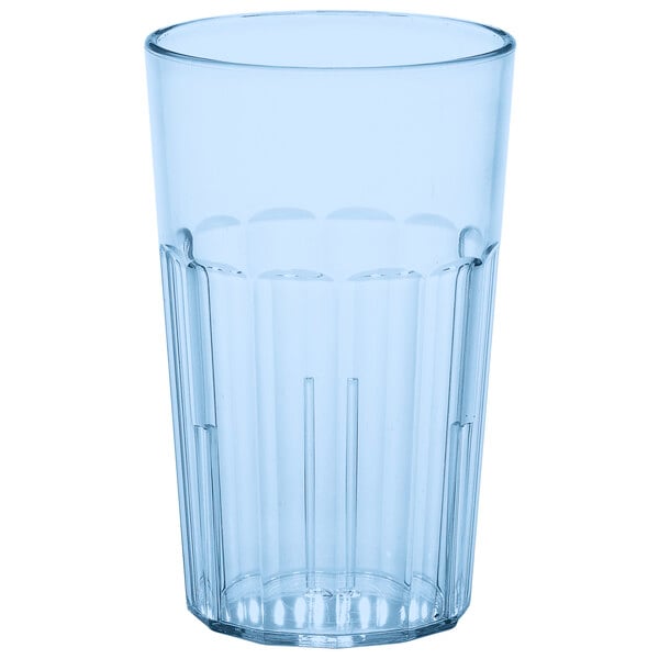 A clear plastic tumbler with a blue rim.