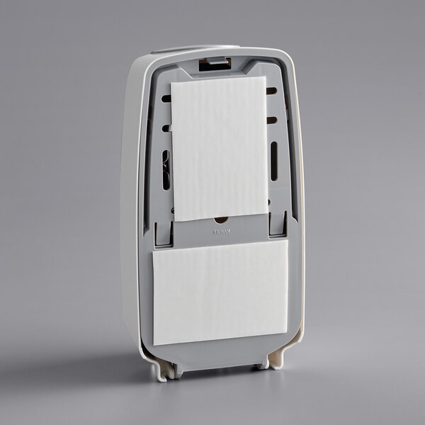 A white rectangular Noble Chemical touch-free hand soap dispenser with grey accents.