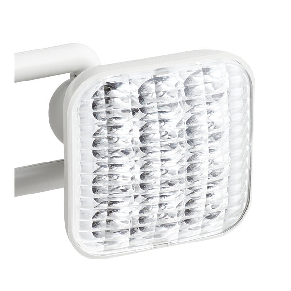 A white square light with a red LED exit sign and emergency light combo.