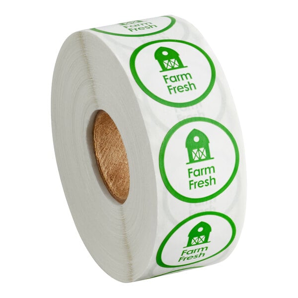 A roll of round green 'Farm Fresh' labels with a barn graphic, containing 1,000 stickers.