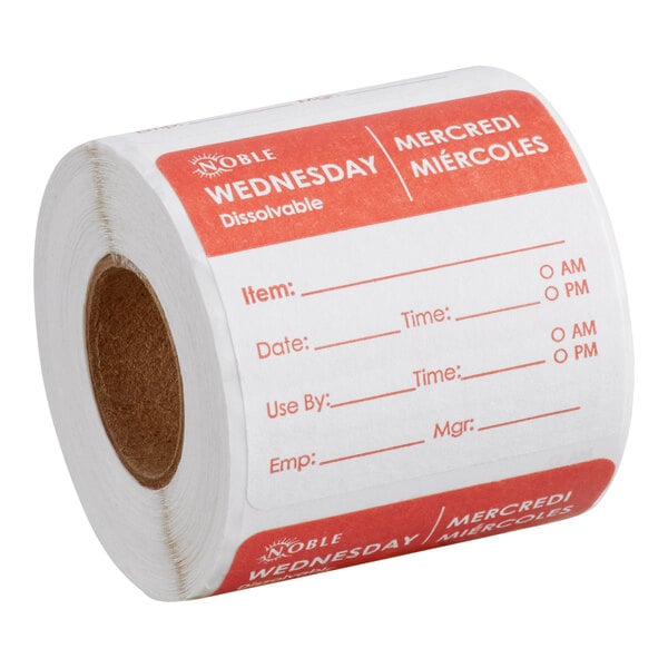 A roll of Noble Products Wednesday dissolvable day of the week labels with spaces for item, date, time, use by, employee, and manager information.
