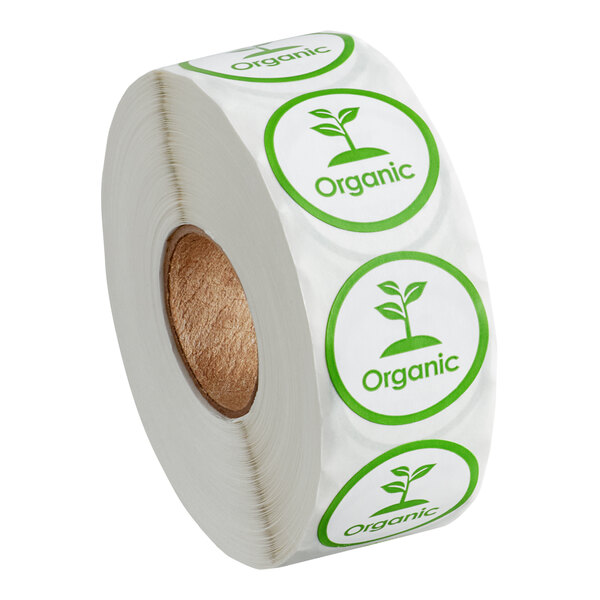 A roll of white paper with green Point Plus organic labels with green leaves.