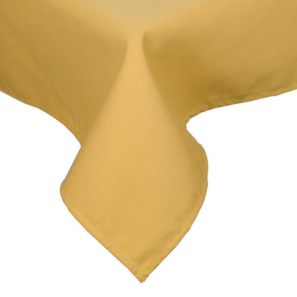 A yellow Intedge rectangular tablecloth with a folded edge.