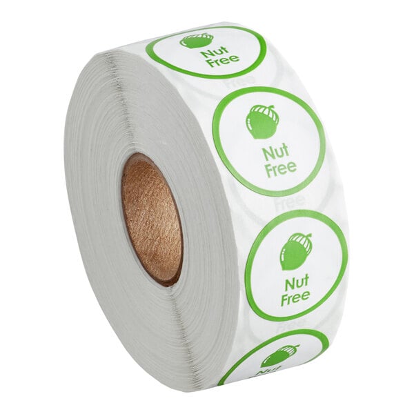 A roll of green and white Point Plus "Nut Free" stickers.